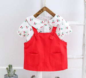 Two piece cherry print blouse and red dungaree dress